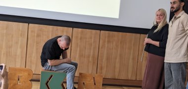Trying out the stool with the letter K